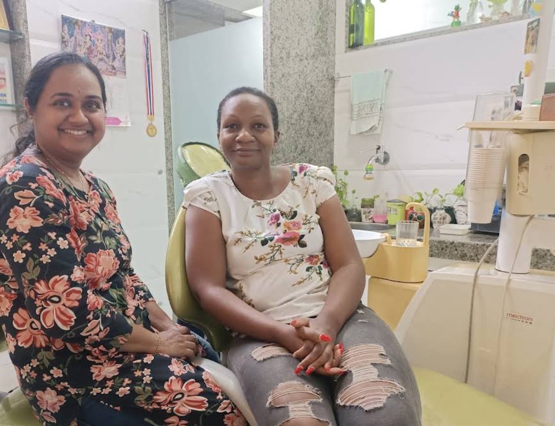 Dr. Aarathi with a patient beside the dental chair at Winning Smile, Andheri East